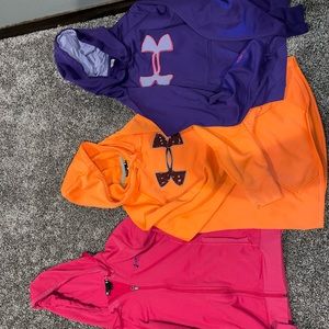 Size Medium Under Armor hoodies/zip. All 4 included